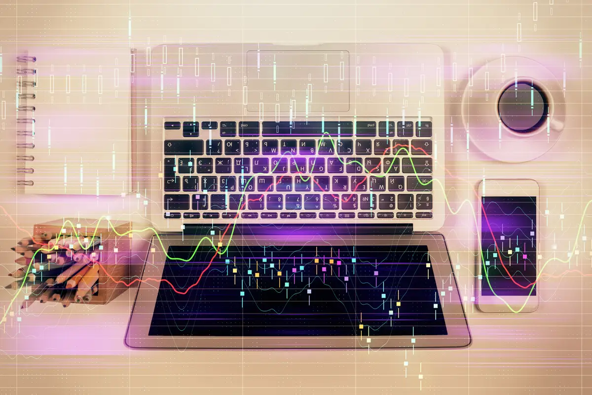 Stock market chart and top view computer on the table background Multi exposure Concept of financial analysis