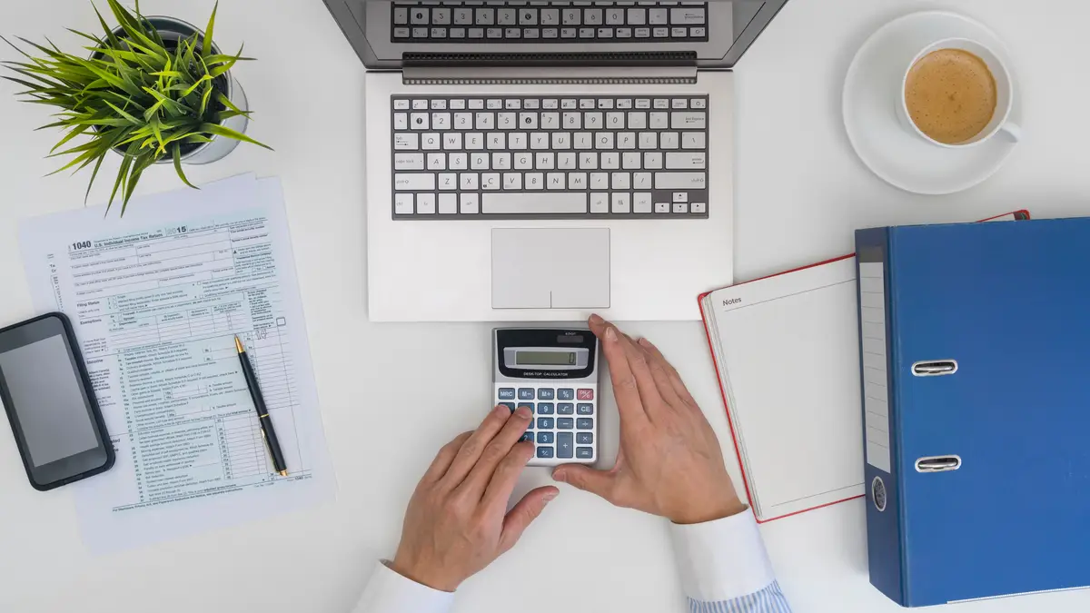 4K Photograph Capture Entrepreneur computing and completing tax paperwork