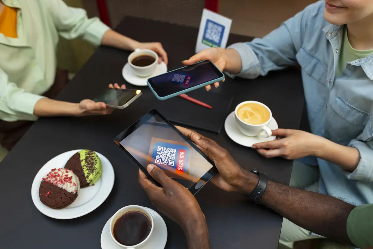 High angle friends reading menu in restaurant