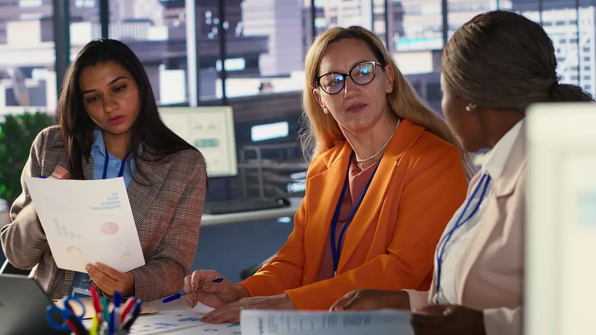 Ambitious women executives collaborating in a diverse work environment