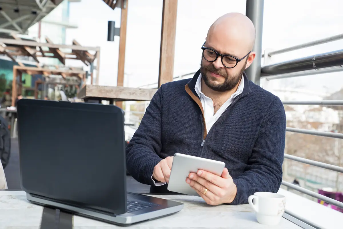 Successful businessman keep working during coffee break