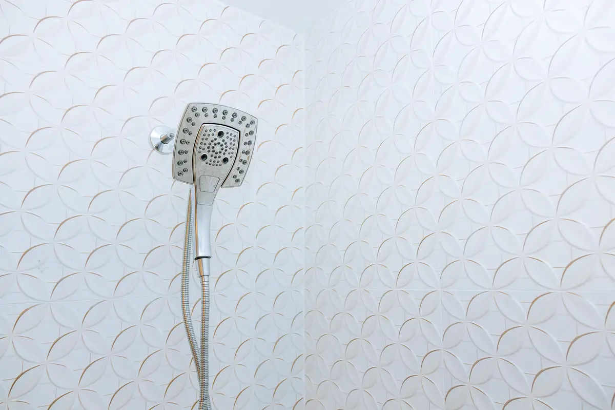 Low angle view of electric lamp on wall at home