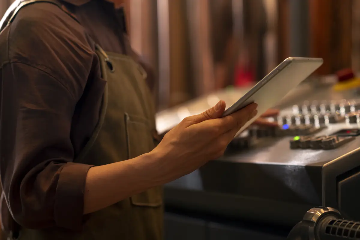 Side view man working at beer factory