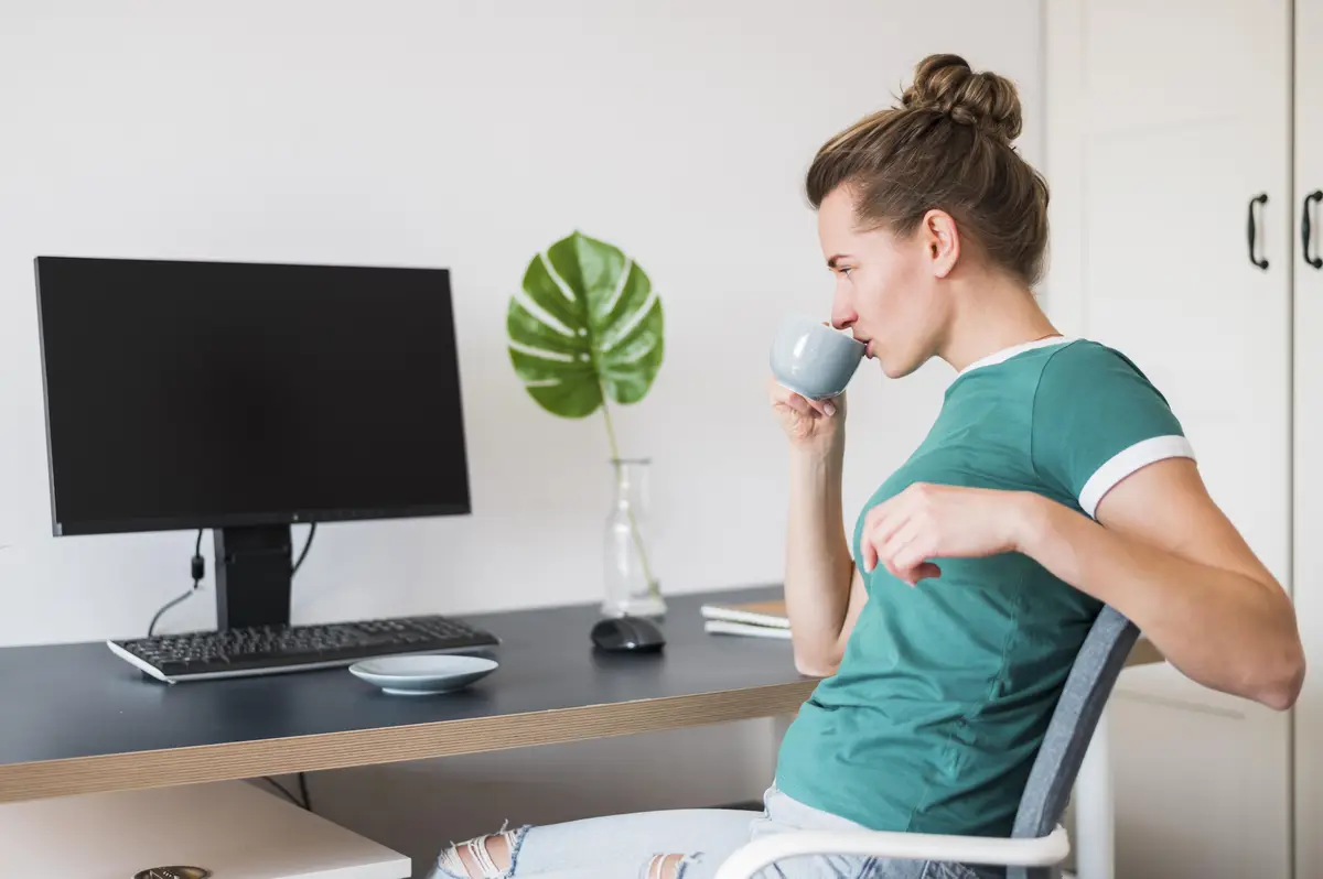 Front view of woman at desk with copy space