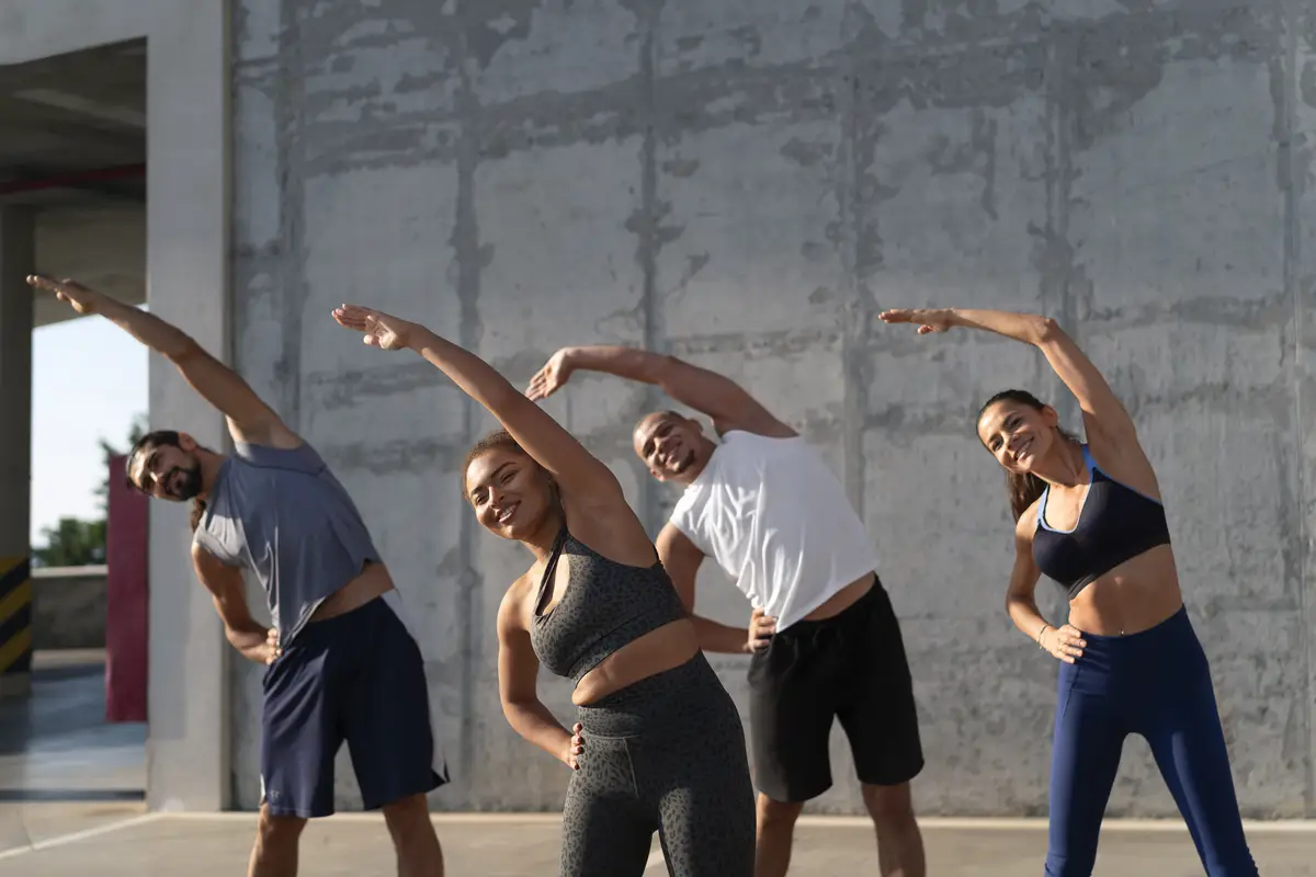 Group of people exercising together outdoors