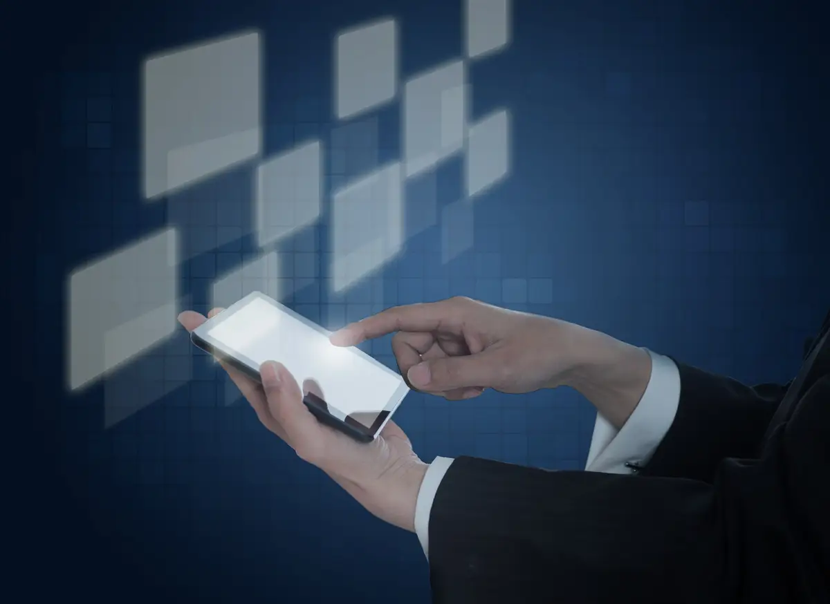 Hand holding a mobile with virtual squares