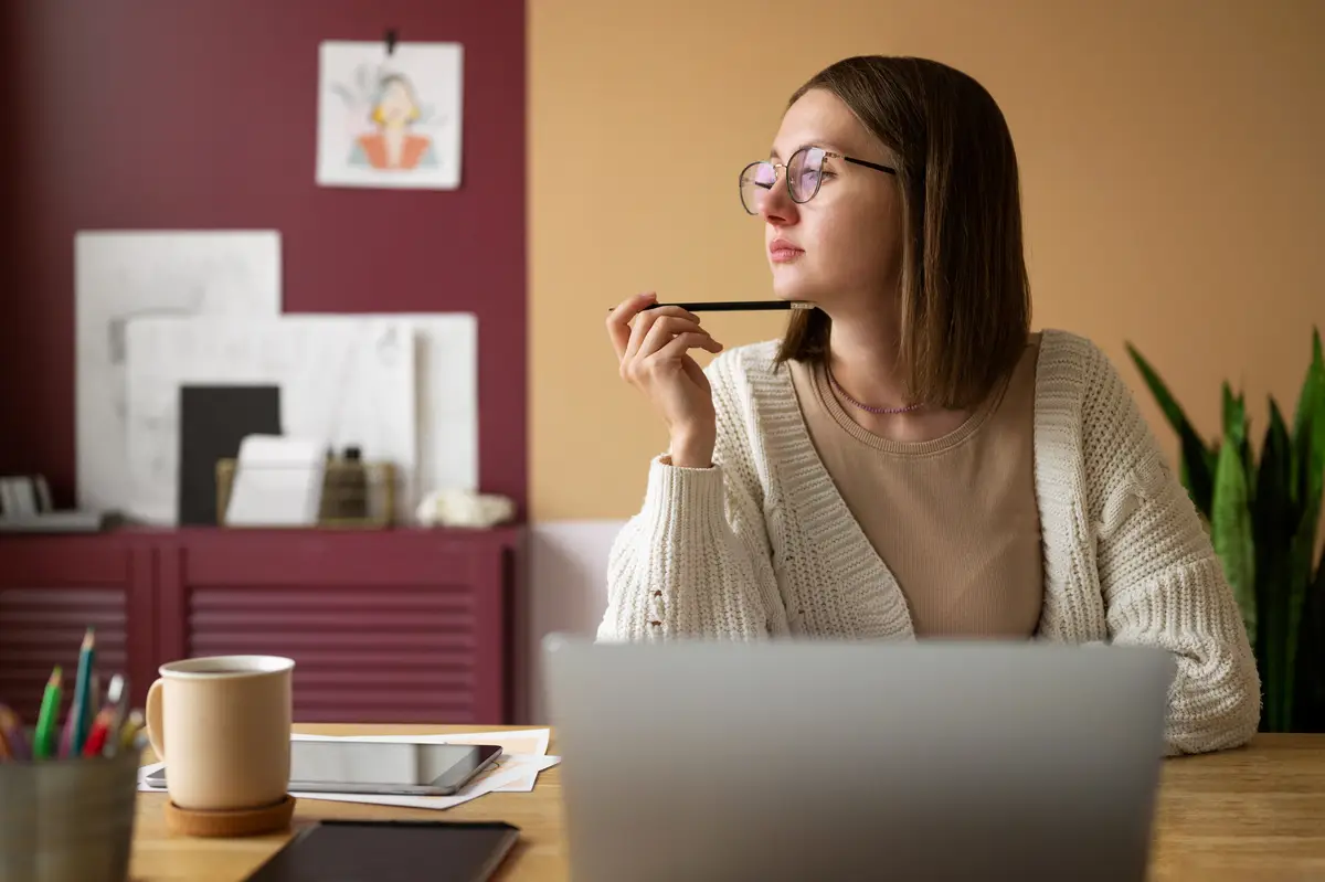 Adult female illustrator working on tablet device