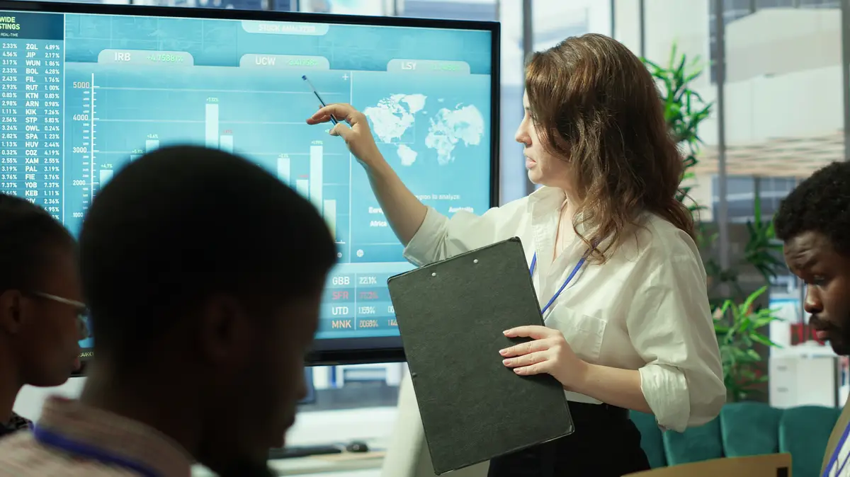 Business associates reviewing key performance indicators within the enterprise