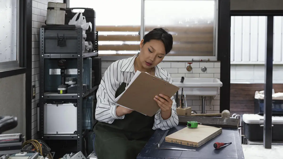 Japanese woman holding clipboard medium shot