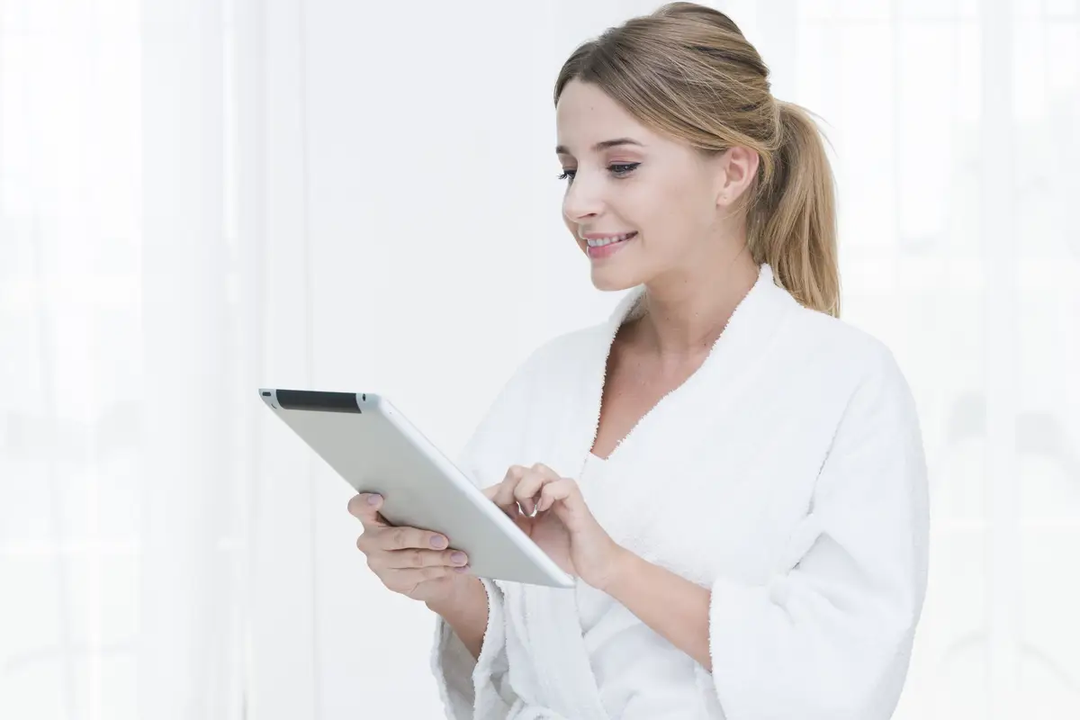 Woman using a tablet in a spa