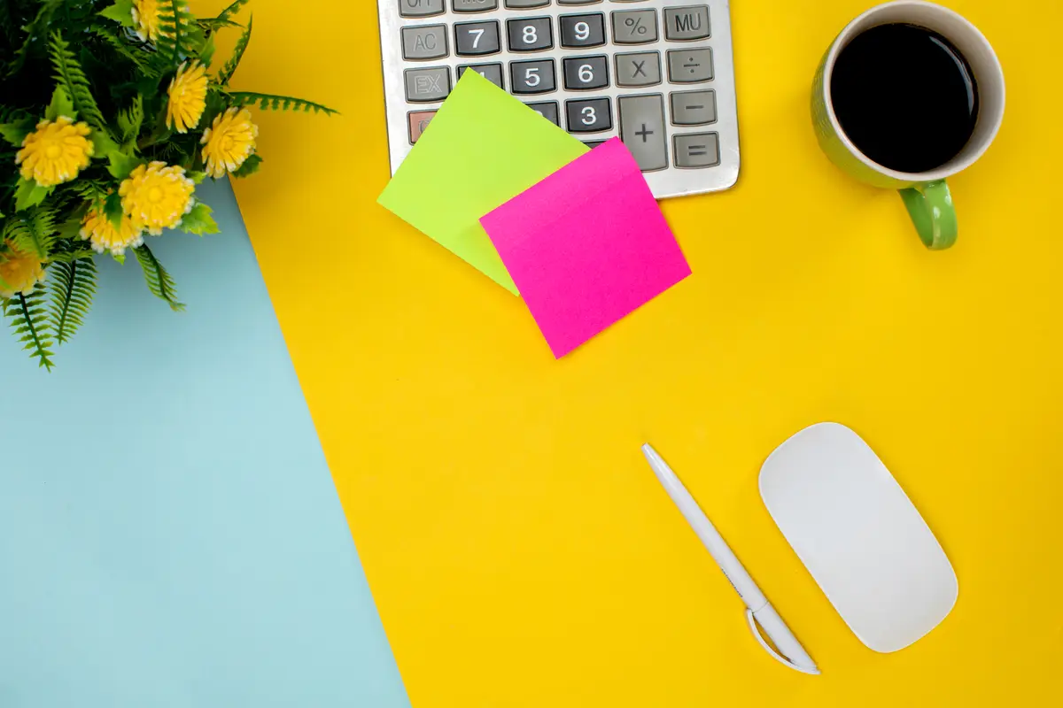 Stick paper wireless mouse and cup of coffee