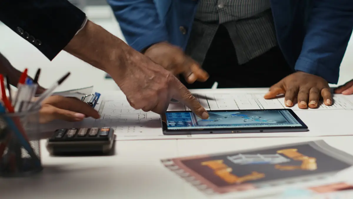 Factory experts design assembly facility production lines in tablet CAD program