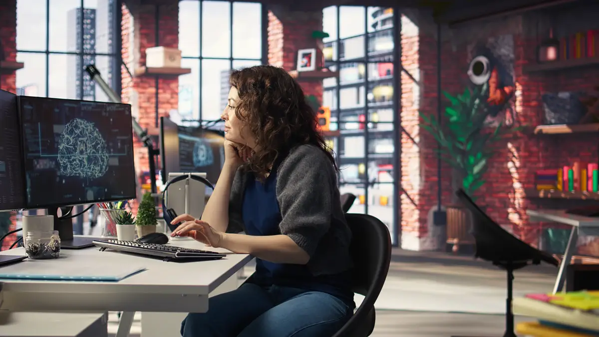 Teleworking developer using computer for artificial intelligence brain