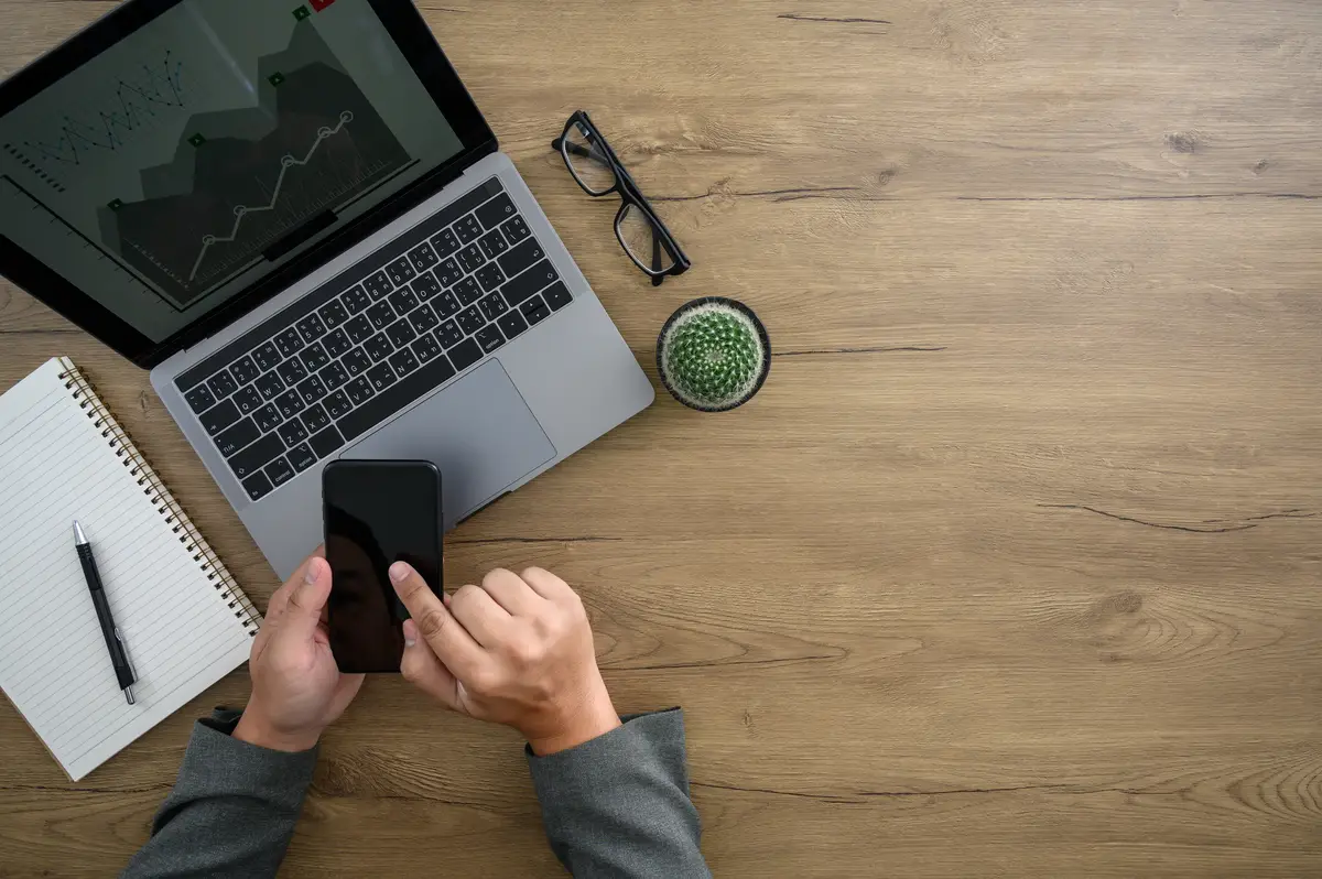 Office desktop Computer Laptop man hands working on modern laptop computer top view