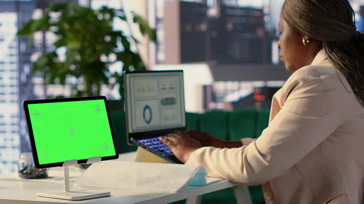 Black general director working in her own office with green screen