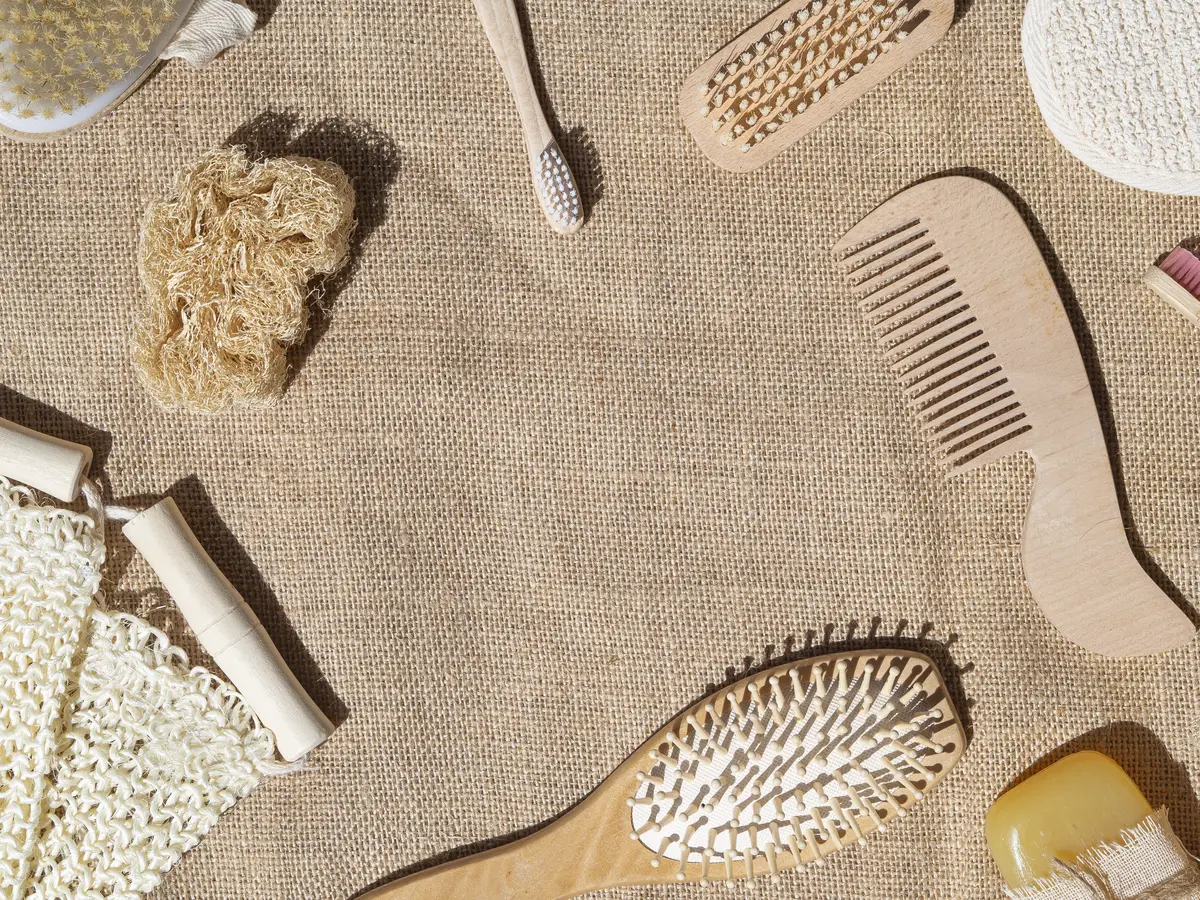 Top view frame with comb, brushes and copy-space