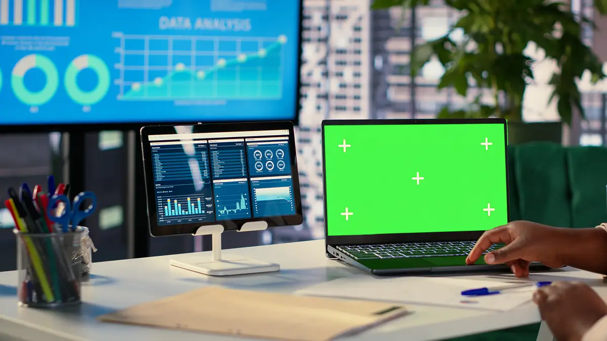 Young general manager using green screen and evaluating performance metrics