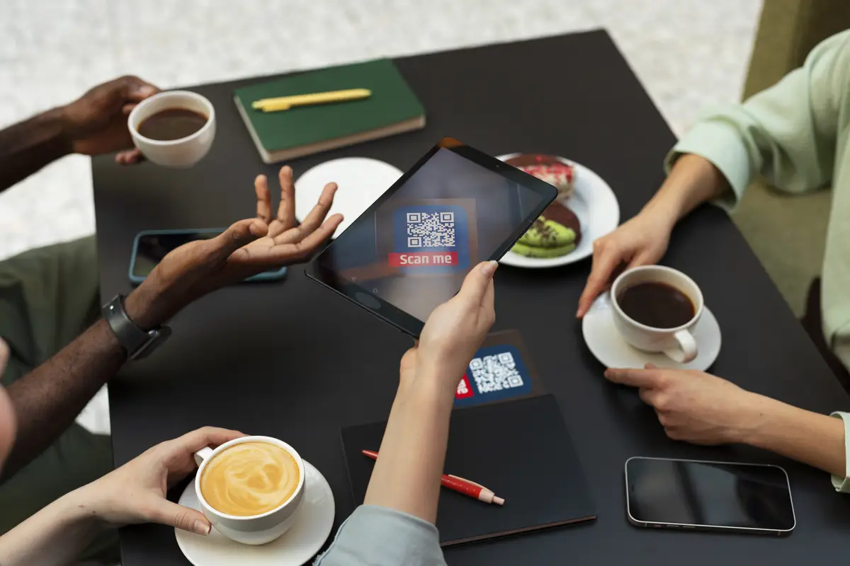 High angle friends reading menu in restaurant