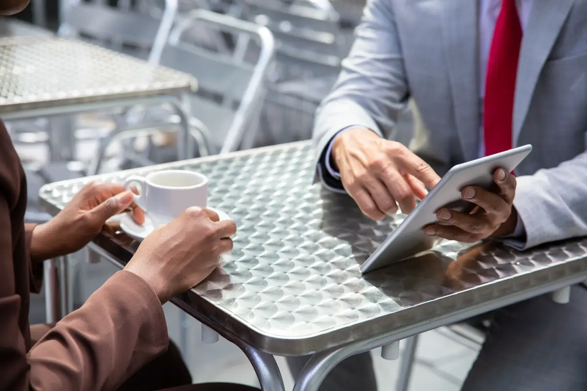Closeup shot of African American man pointing at tablet