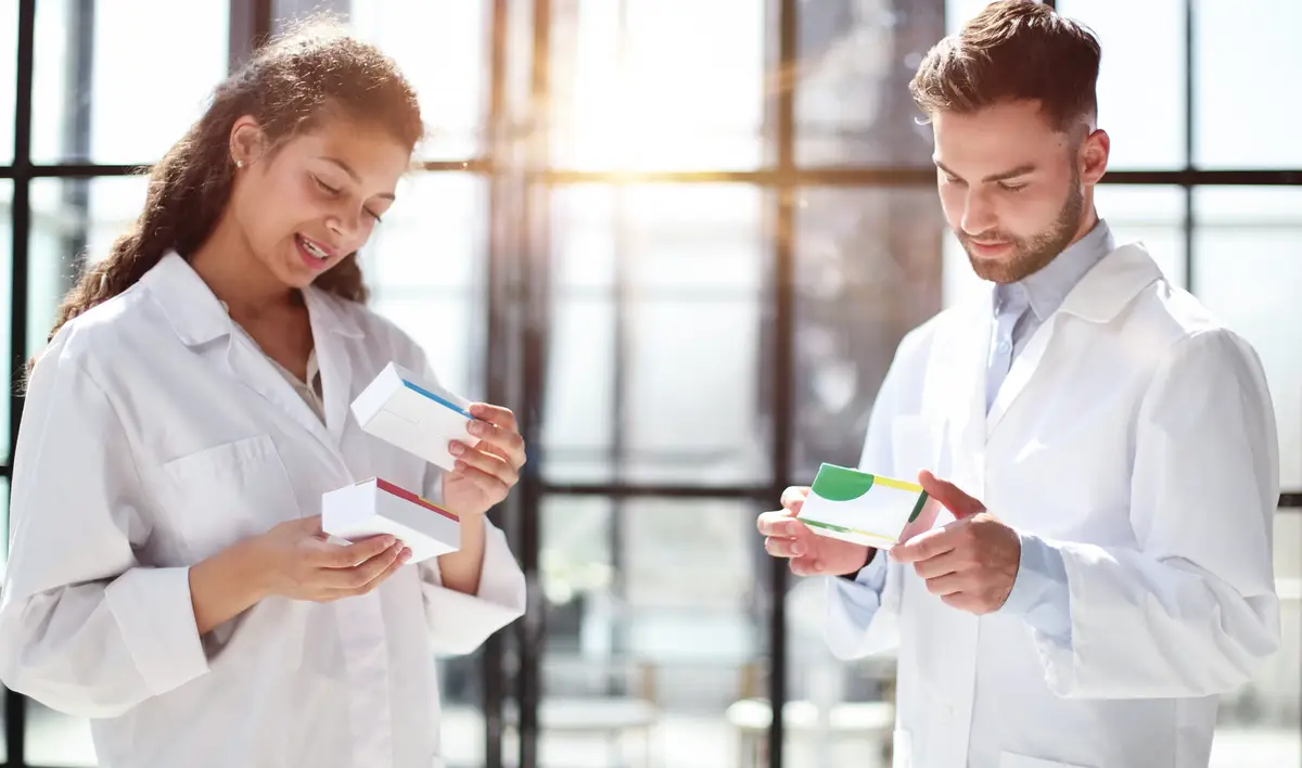 Doctors look at pills in bottle prescription reading and contents healthcare selfhealing concept