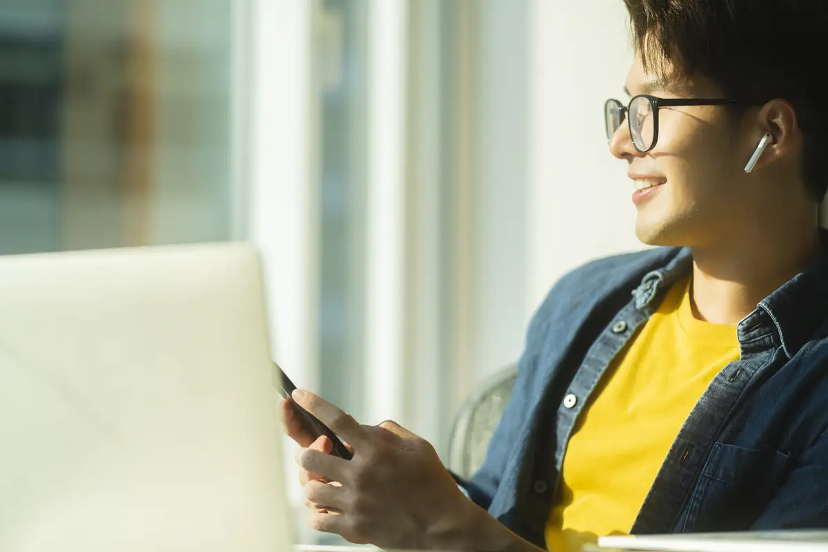 Smart attractive positive asian business male wearing glasses work remote new normal lifestyle hand use laptop tele conference onlive videocall meeting remote business ideas concept