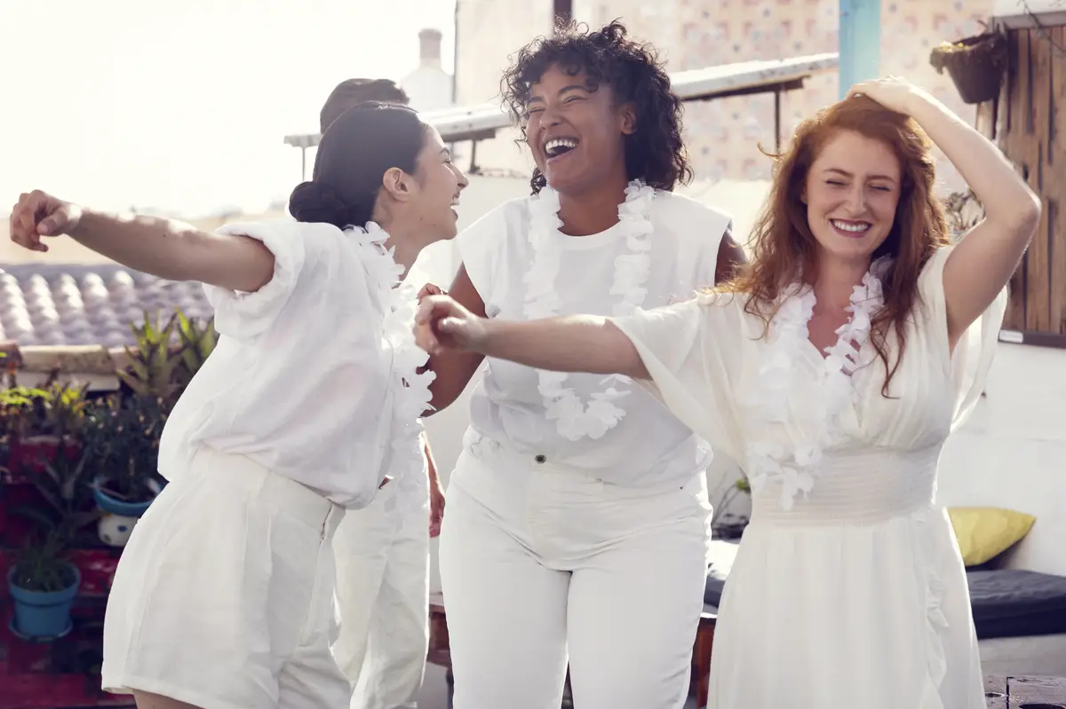 Young adult having fun at white party