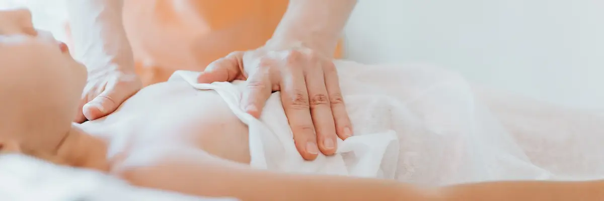 Doctor osteopath hands does physiological and emotional therapy for eight year old kid girl. pediatric osteopathy treatment session. alternative medicine. taking care of the child's health. banner