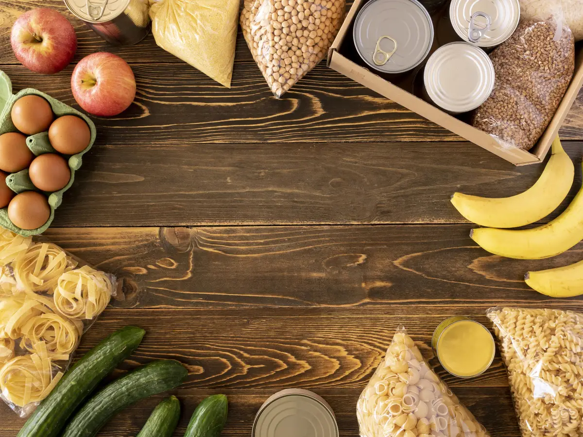 Top view of food for donation with fruits and other provisions