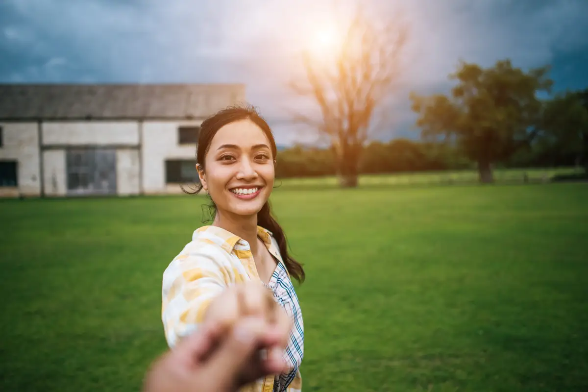 Woman walking on romantic happy holidays holding hand of boyfriend following her