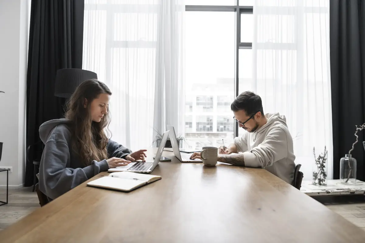 Couple at desk working together from home