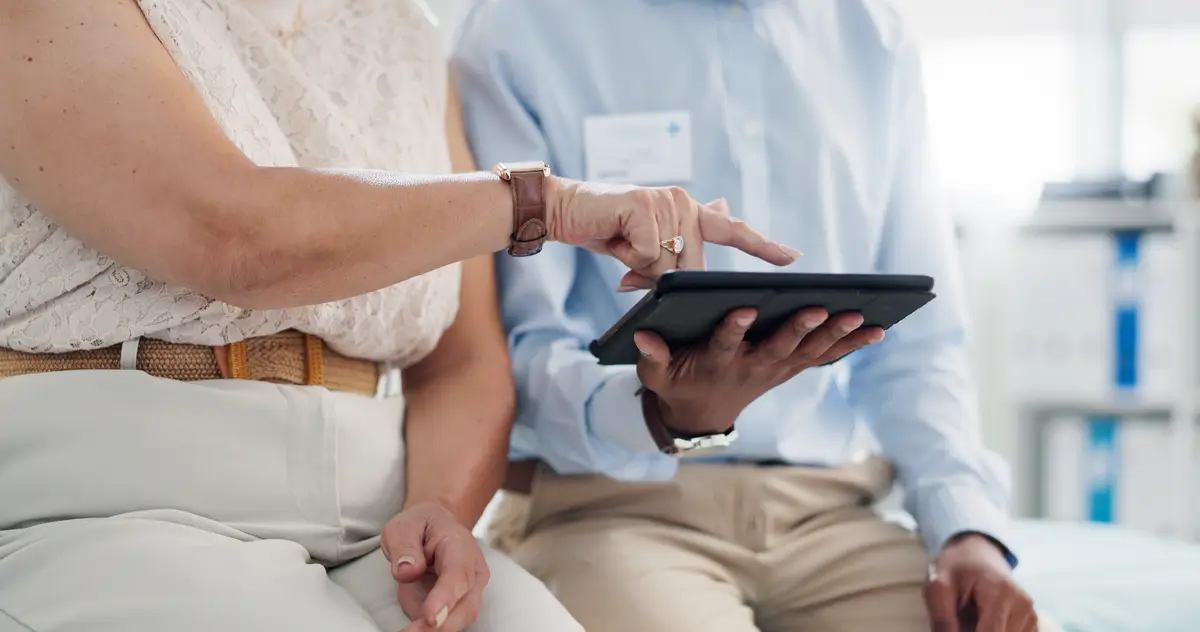Hands doctor and patient with tablet in clinic for results insurance and scroll for healthcare People medic and digital touchscreen with click consultation counselling or chat in hospital office