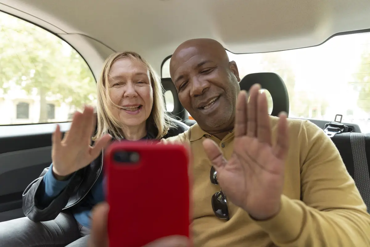 Medium shot smiley people with smartphone