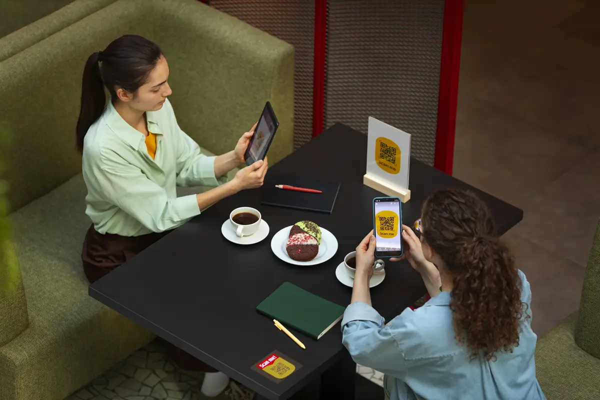 High angle friends reading menu in restaurant