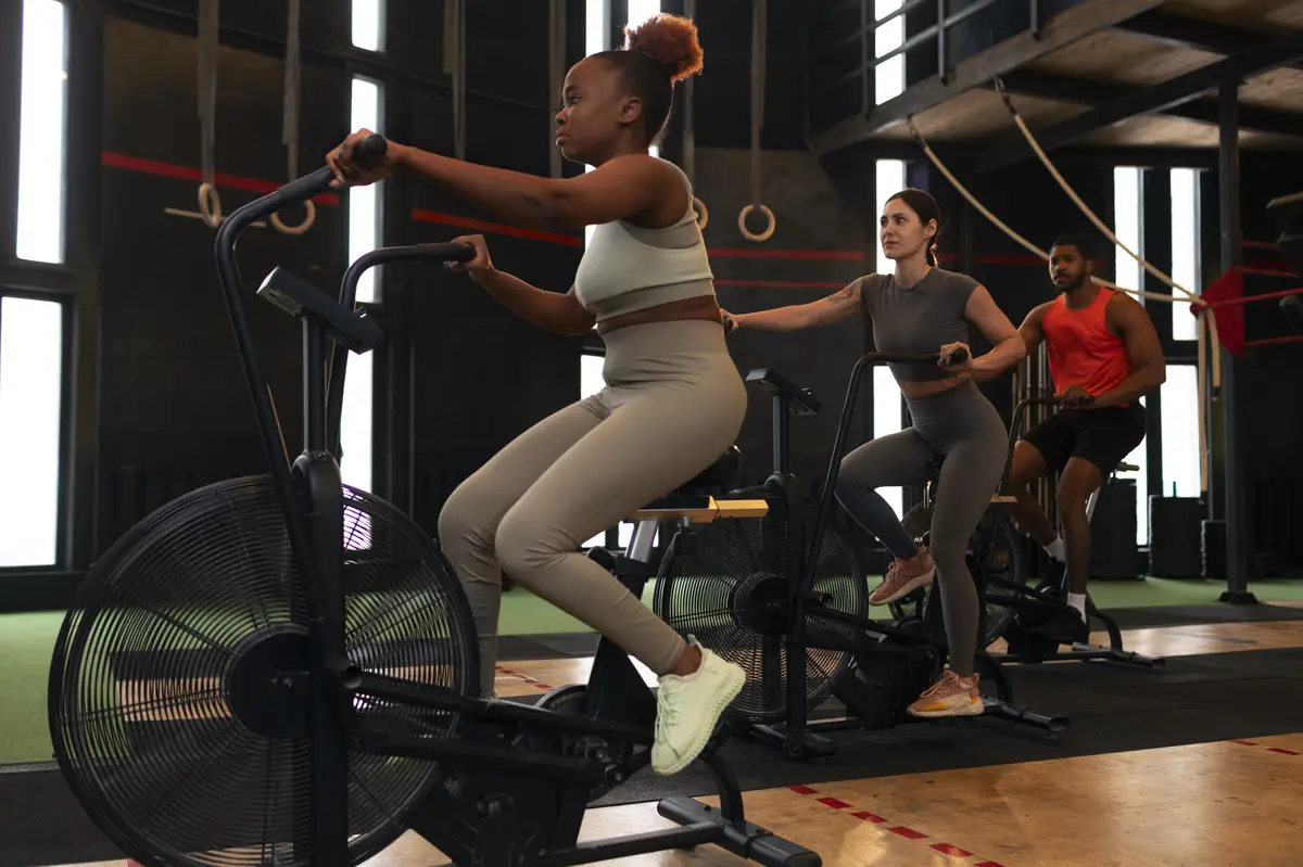 Full shot people training together at gym