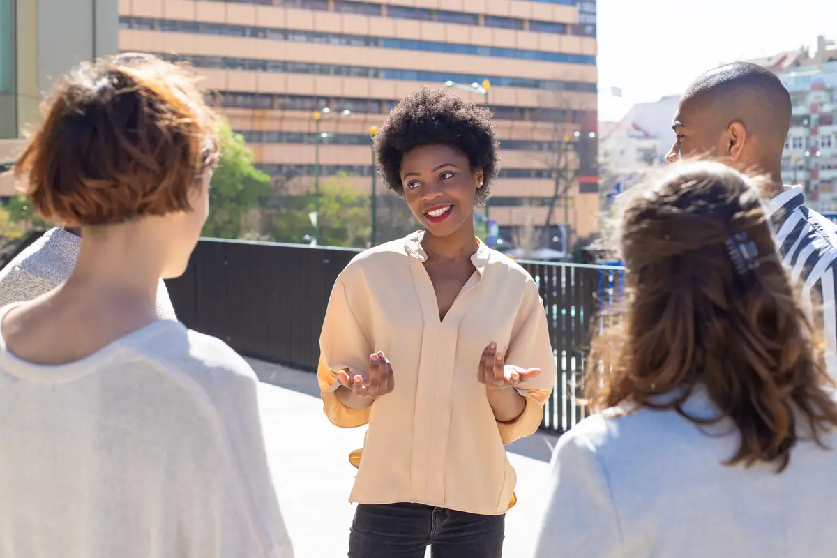 Group of young people standing on street and communicating