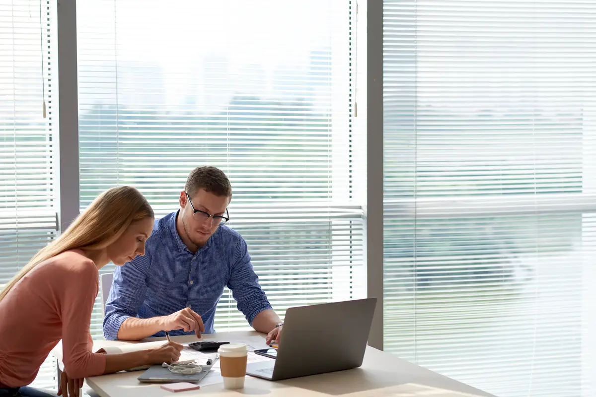 Office coworkers collaborating on project in spacious office
