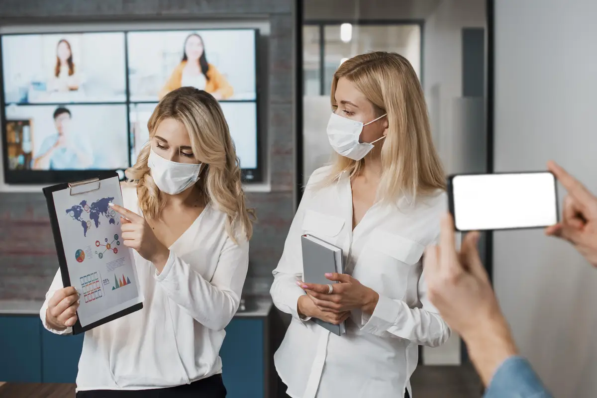 Beautiful businesswomen wearing medical masks