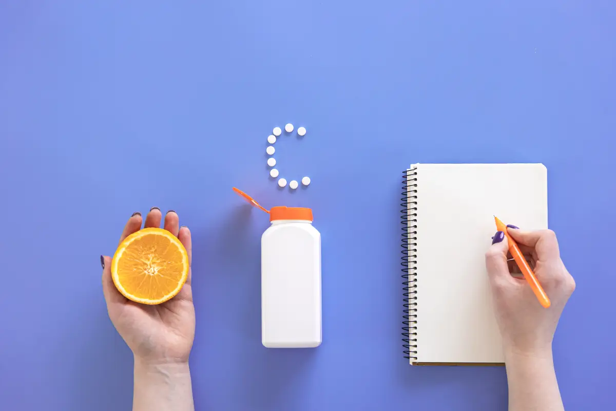 Flat lay pills on blue background vitamin c concept