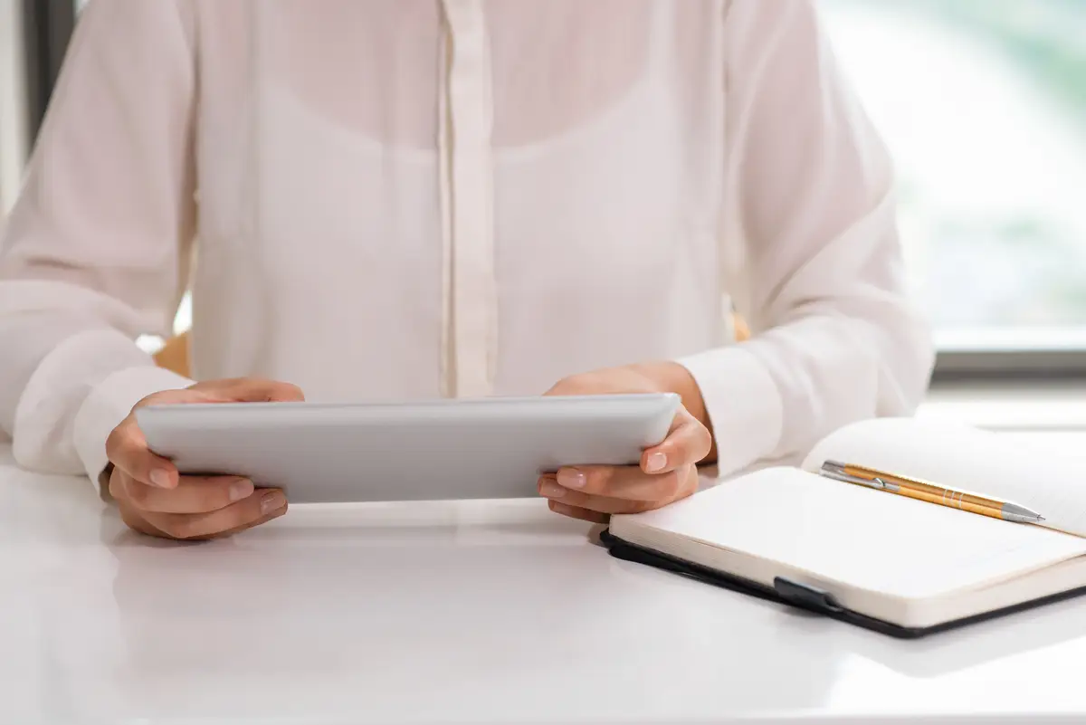Unidentified office employee working with touchpad