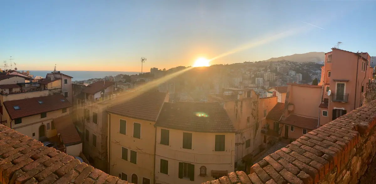 Panoramic shot of townscape against sky during sunset
