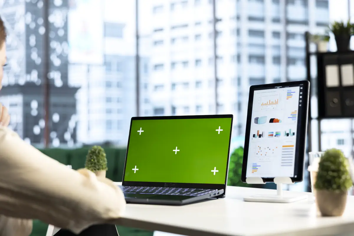 Business director working in her own office with green screen