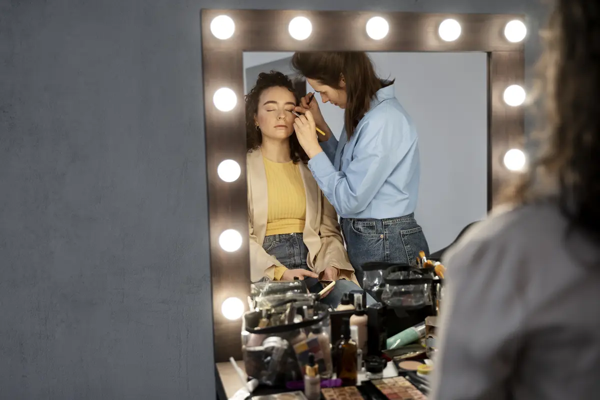 Make up artist getting model ready for photoshootin