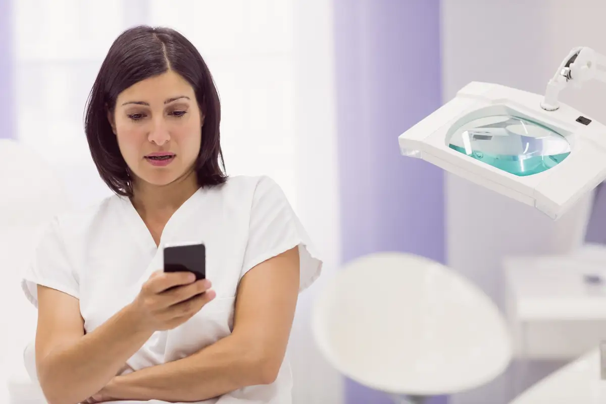 Dermatologist using mobile phone