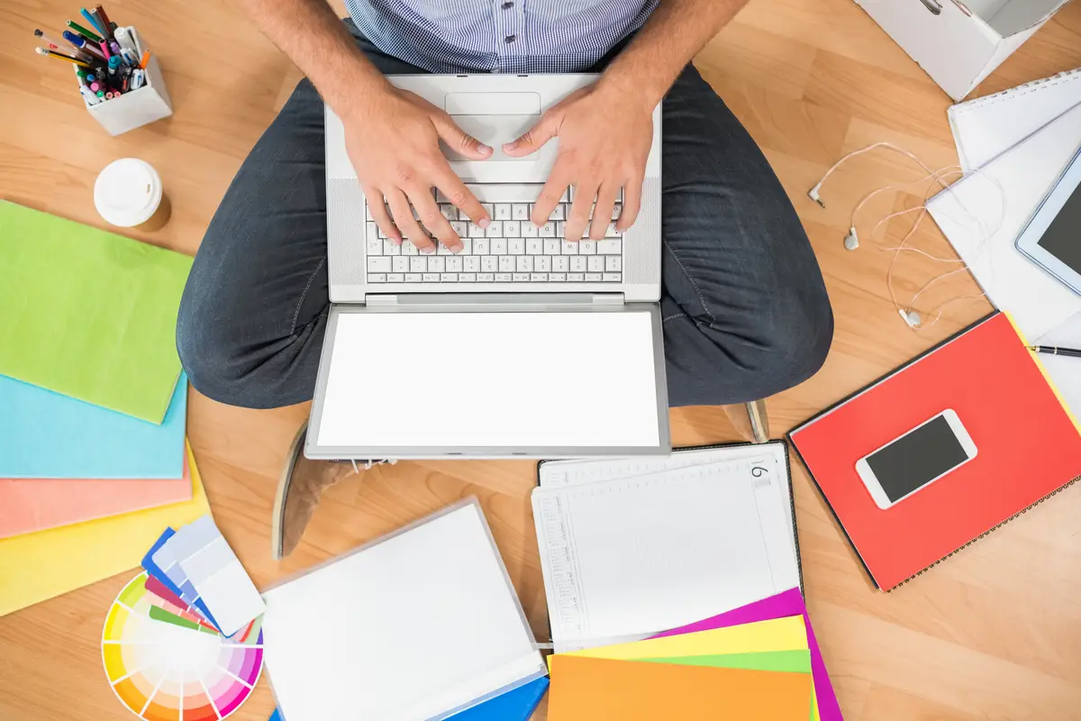 Young creative businessman working on laptop
