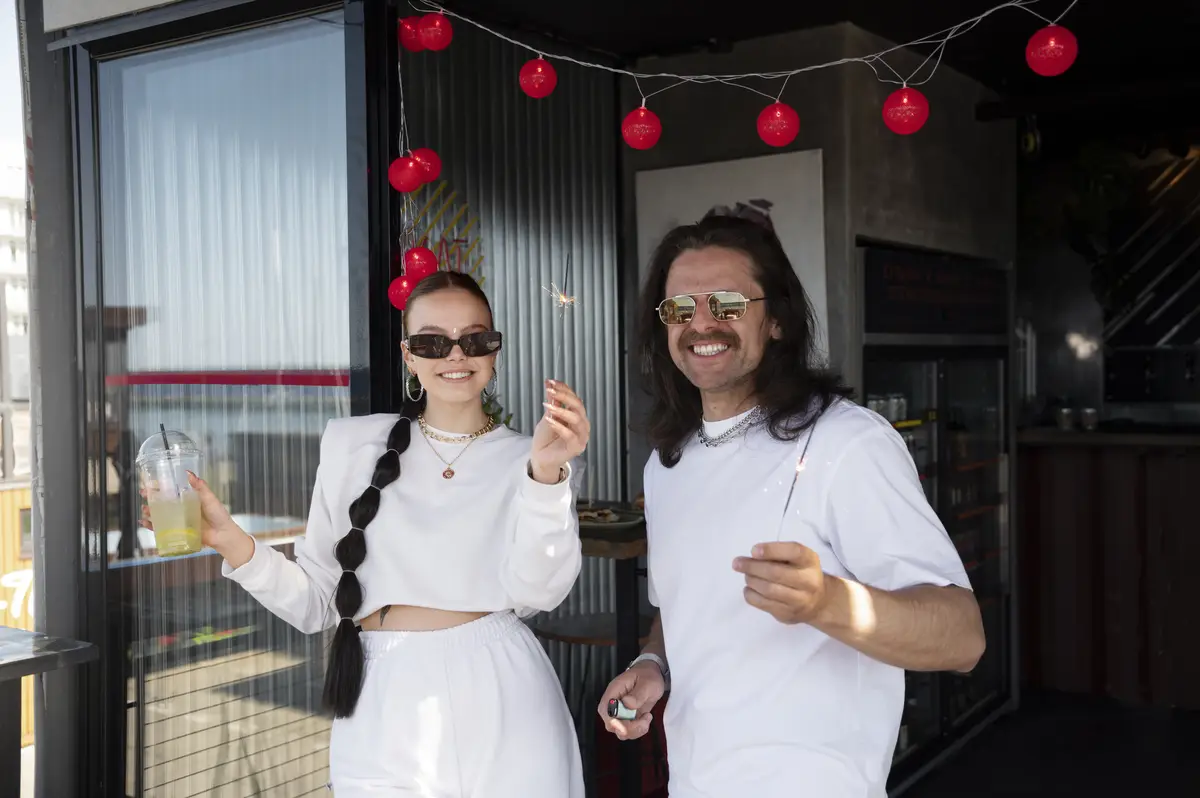 Young people having fun at white party