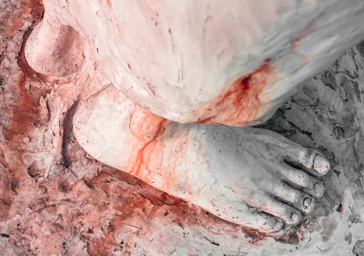 Foot of Christ bloodied