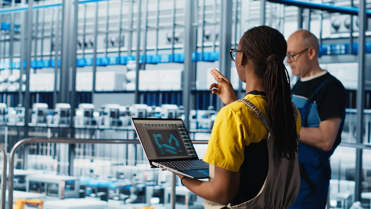 Engineering team working in smart factory collecting and analyzing data