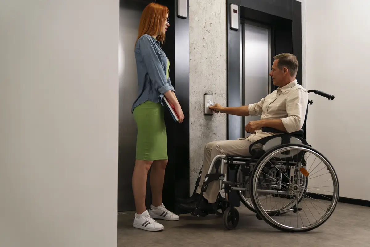 Man in a wheelchair having an inclusive office job