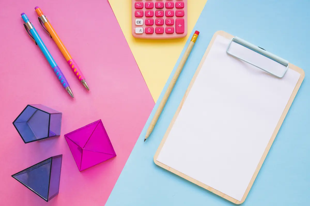 Calculator and geometric shapes near school stuff