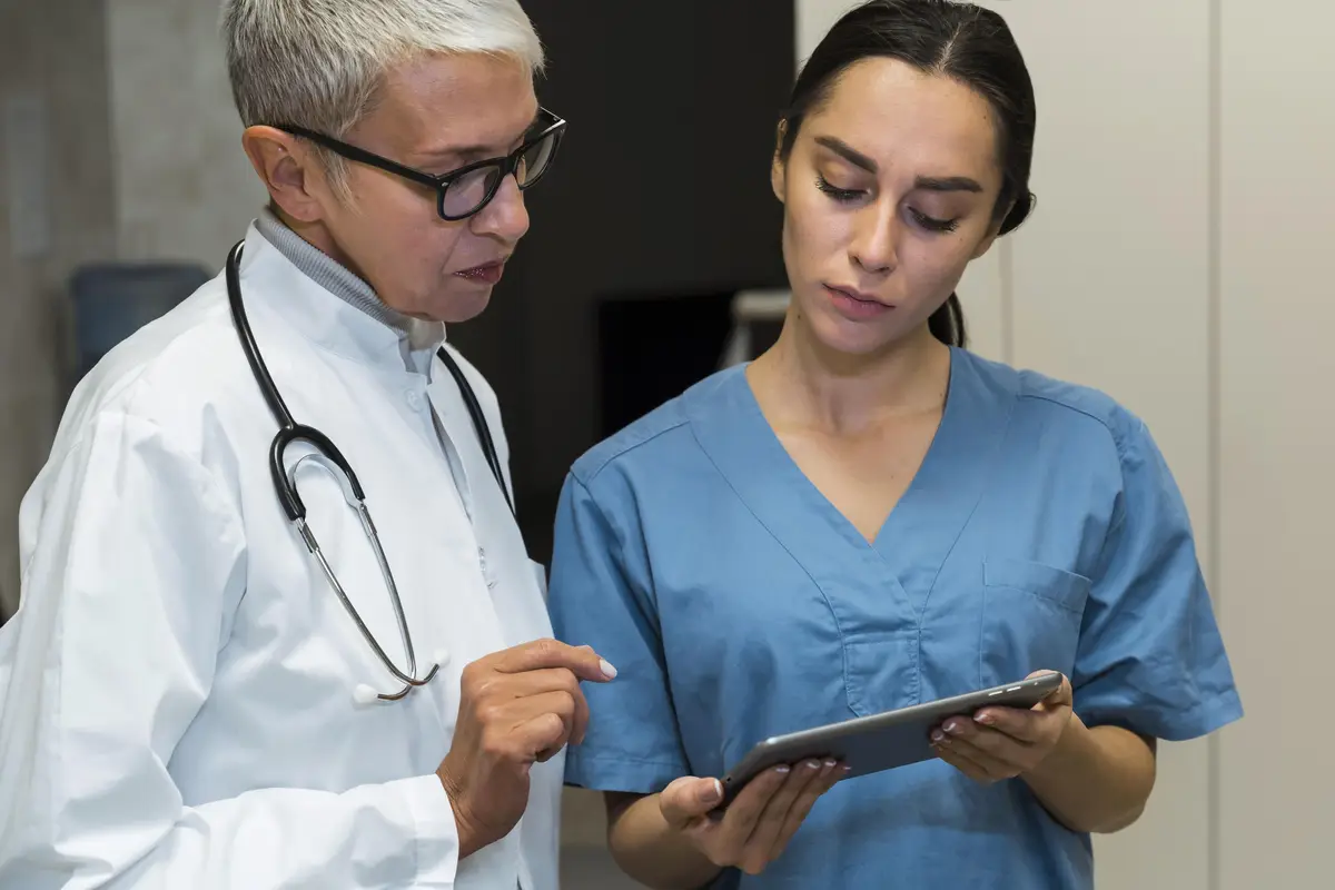 Doctor and nurse talking